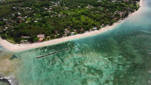 Aerial view of the coastline with a breakwater alt