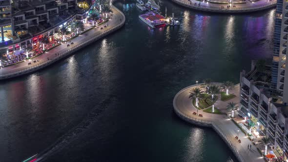 Waterfront Promenade in Dubai Marina Aerial Night Timelapse alt