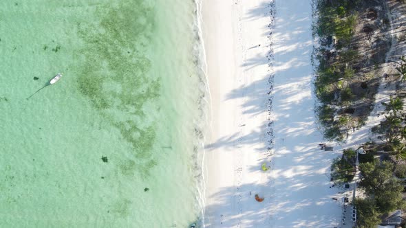 Aerial View of a Boat in the Ocean Near the Coast of Zanzibar Tanzania alt