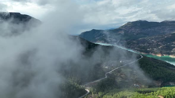 Clouds in the mountains above the river aerial view Turkey Alanya 4 K alt