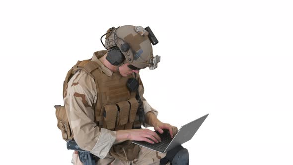 Soldier Using Laptop Computer for Surveillance During Military Operation on White Background alt