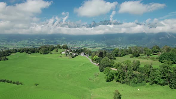 Aerial View of Liechtenstein with Houses on Green Fields in Alps Mountain Valley alt