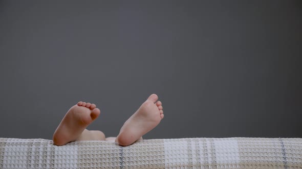 Small Bare Legs Kids in Sofa Child Close Up Toes