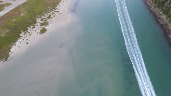 Boat Seen Racing on River From High Angle View alt