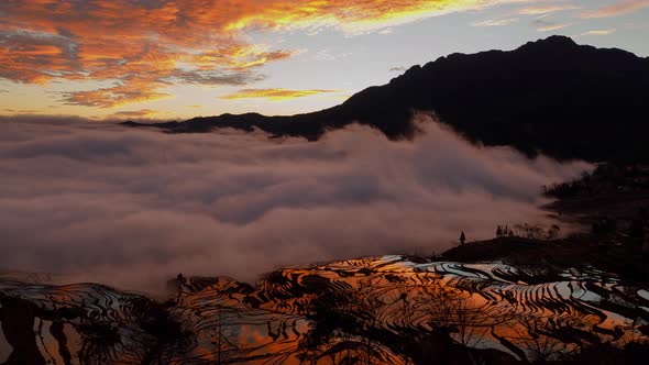 Amazing time lapse of the morning fog coming in at the terraced rice fields in Yuanyang China alt