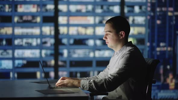 Businessman Returning to Office Opening Laptop Lid and Continue in Evening Work alt