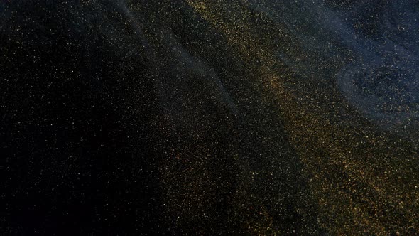 Beautiful Golden Shimmering Particles in White Smoke on a Black Background alt
