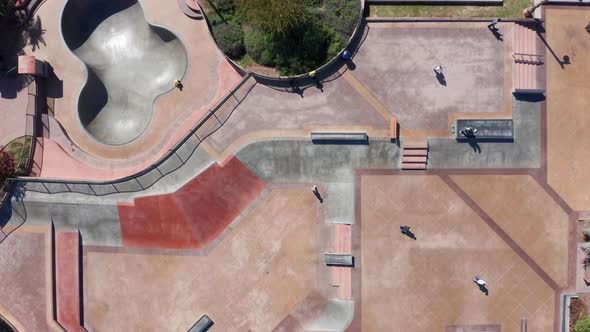 Drone shot flying over a skate park in Cardiff beach community, America alt