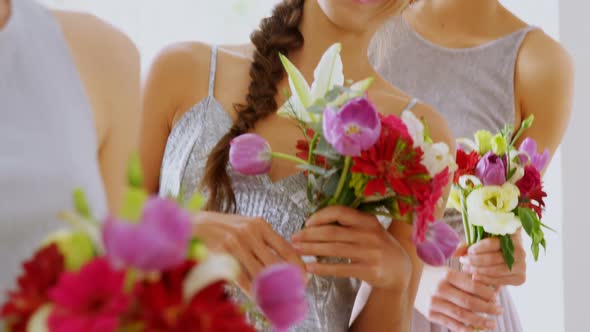 Happy bridesmaids in grey dresses holding flowers 4K 4k alt