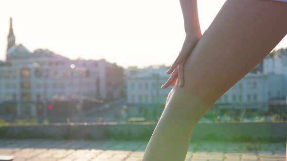 Attractive  Young Woman Runs Her Hand Over Her Leg in Sexy Dance Moves alt