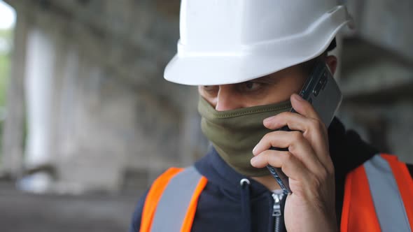 Talking on a Cell Phone at a Construction Site