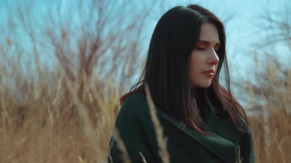 Young Brunette Among the Reeds