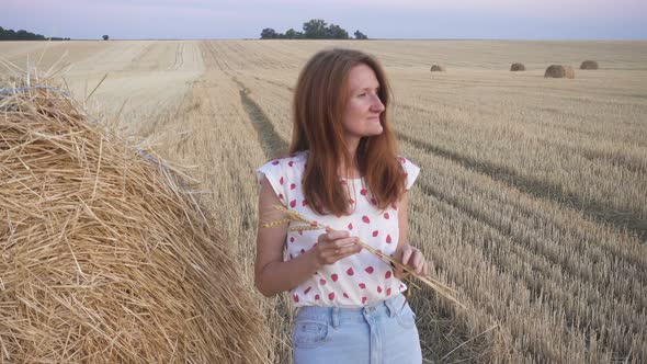 Portrait Of A Beautiful Young Smiling Girl Near The Round Bale 3 alt
