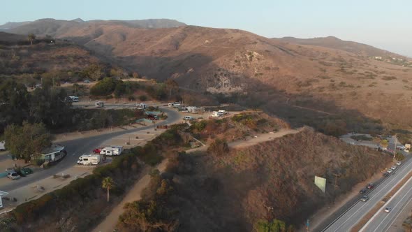 Waves crash over the beach in Malibu, California near the famous Malibu RV Resort alt