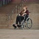 Hopeless Young Woman in the Wheelchair in Front of the Inaccessible Stairs. - VideoHive Item for Sale