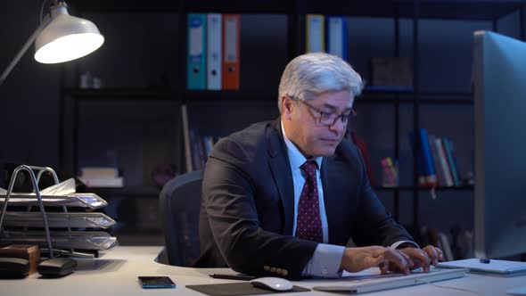 Businessman angry at paperwork. alt