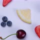Rotation Background of Blueberries Strawberries Cherries and Lemon Slices on a White Background the - VideoHive Item for Sale