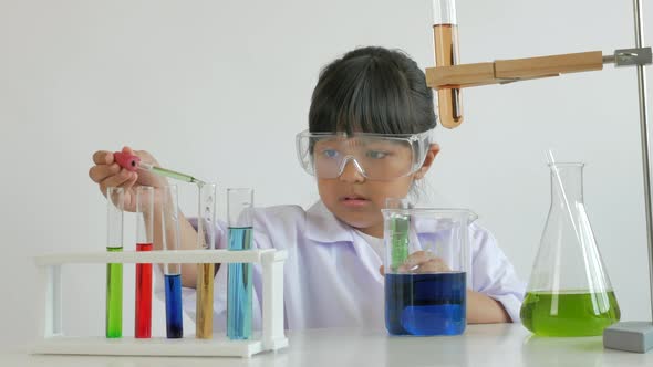 Children play and learn chemical in laboratory