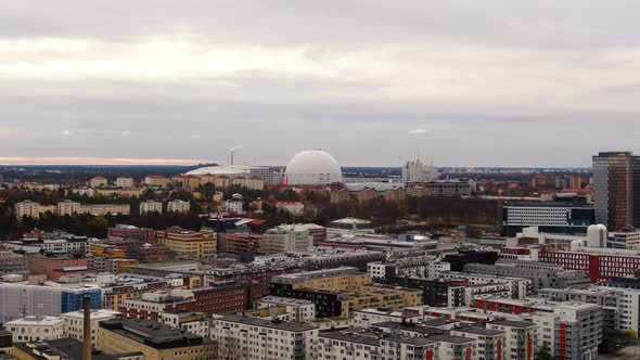 Aerial push in shot towards Ericsson Globe on overcast fall day alt