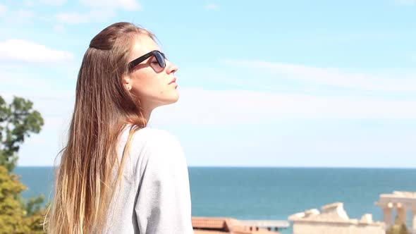 Girl Enjoys Nature And The Sea alt