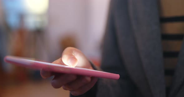 Woman sending sms on mobile phone alt