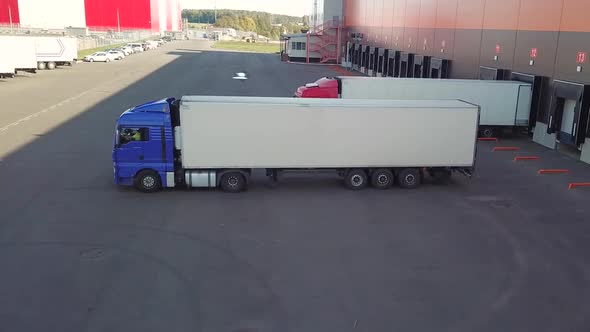 Truck Are Parking To Dock of Logistics Center alt