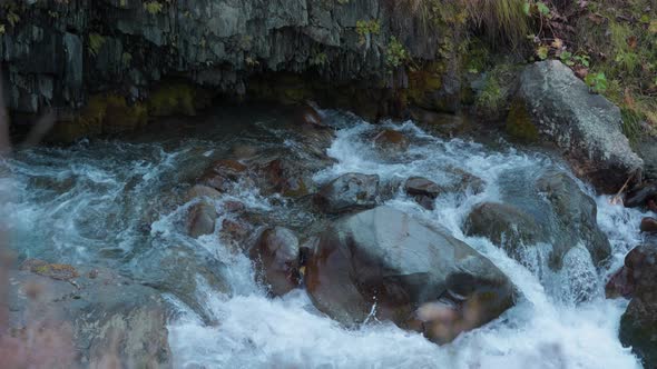 Mountain river flowing around boulders