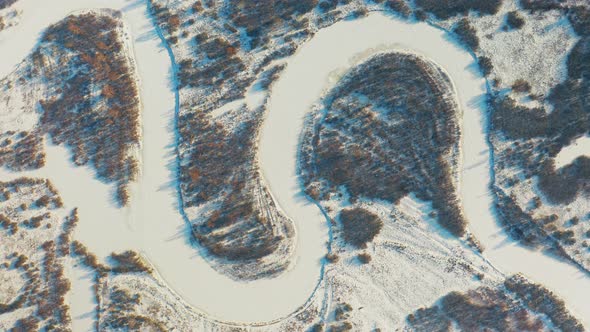 Beautiful Snowy White Forest And Curved Frozen Snow Covered River In Winter Frosty Day alt