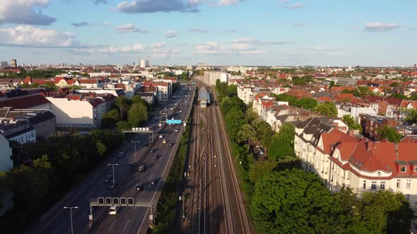 Berlin S-Bahn Subway and Autobahn freeway ring.Great aerial view flight fly forwards drone footage alt