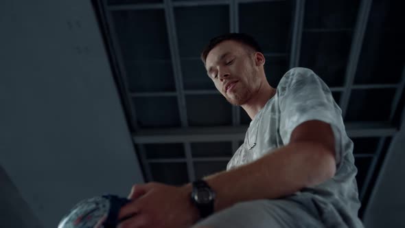 Sporty Teenager Putting on Safety Helmet Before Roller Skating at Skate Park alt