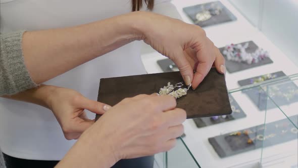 Women Earrings in Silver with White Gems in the Jewelry Store alt