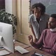 Two Colleagues Using Computer Together - VideoHive Item for Sale