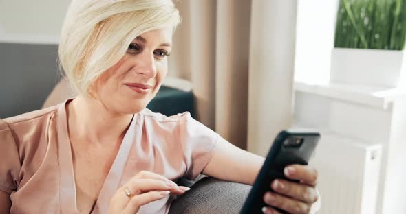 Closeup of Woman Scrolling Smartphone