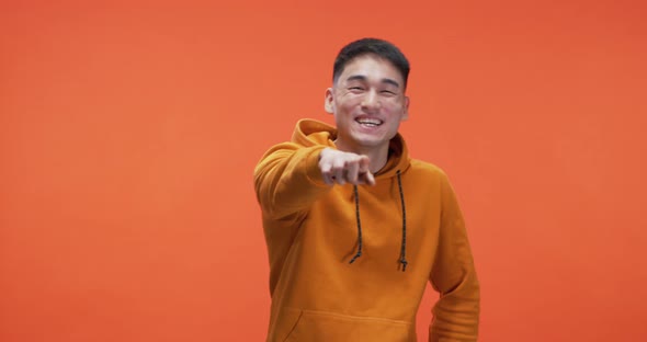 Young Man Pointing at Camera alt