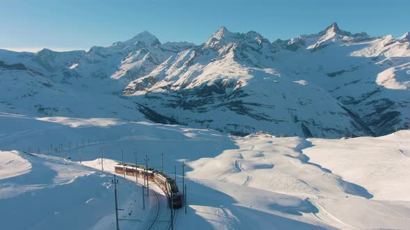 Matterhorn Mountain and Gornergrat Train in Winter at Sunset alt