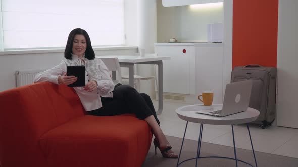 Businesswoman in Business Trip Calling Client alt