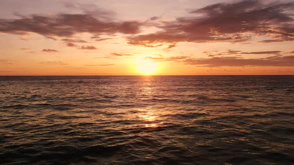 Drone shot sunset over ocean