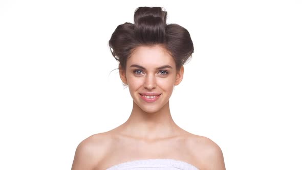 Topless Girl with Evening Hair Style Smiling Over White Background in Slowmotion alt