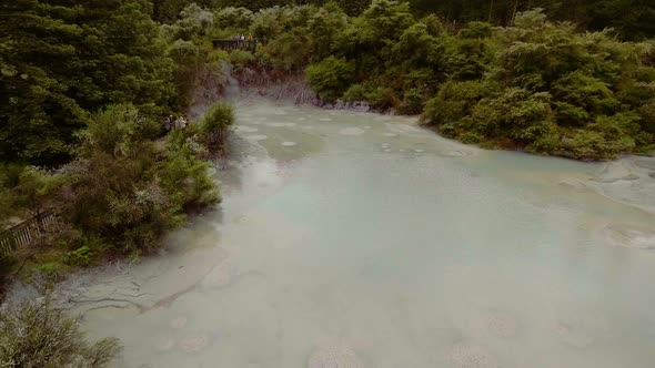 Bubbling Hot Mud Pool in Rotorua, New Zealand from Aerial View by Drone alt