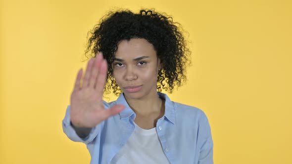 Portrait of Casual African Woman Showing Stop Sign By Hand alt