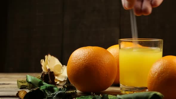 Man Bothers Orange Juice And Oranges Nearby
