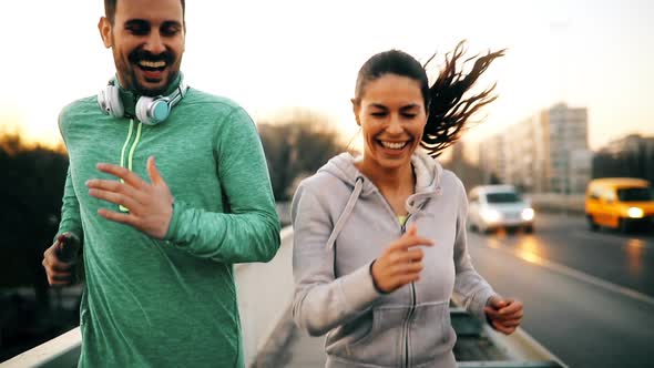 Happy Friends and Sports People Jogging and Running Outdoor