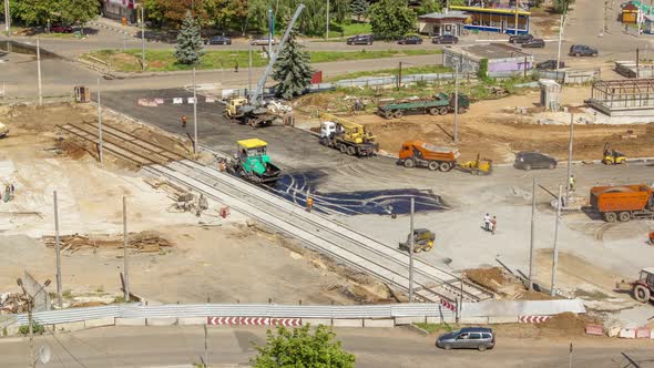 Asphalt Paver Roller and Truck on the Road Repair Site During Asphalting Timelapse alt