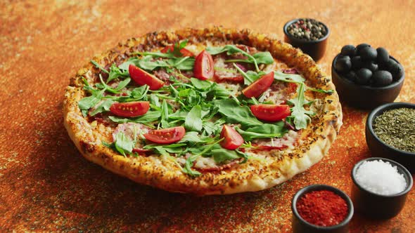Tasty Pizza on a Rusty Background with Spices, Herbs and Vegetables alt