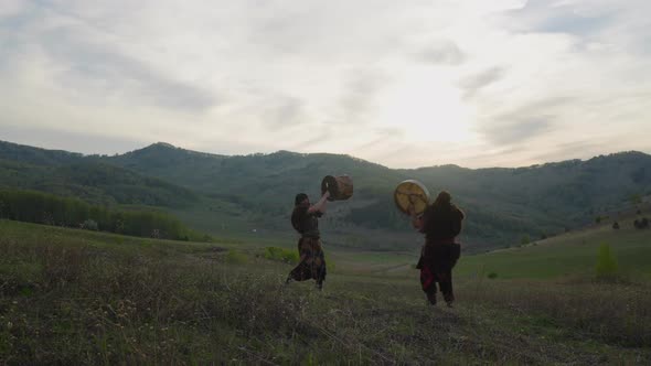 Men in Traditional Altai Clothes Conduct Fertility Ritual alt