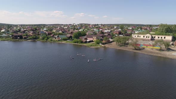 Aerial view of Stand Up Paddling on pond in provincial city 01 alt
