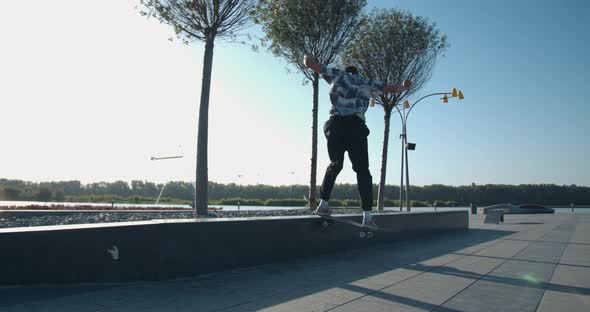 Young Man Is Rail Sliding at the Skatepark, Doing Skater Tricks,  alt