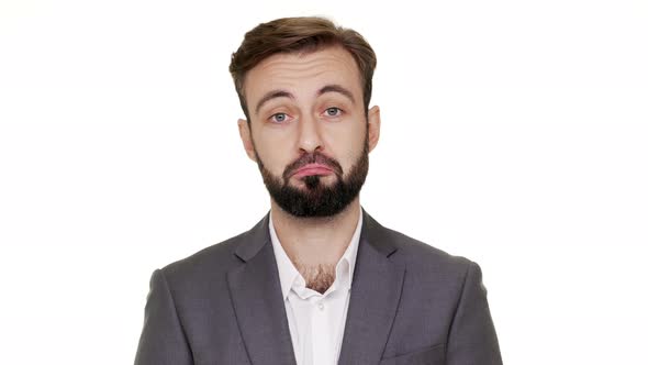 Closeup Portrait of Serious Man in Business Suit Expressing Acceptance with Facial Expressions alt