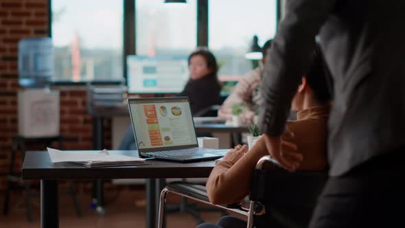 Asian Woman Greeting Office Colleagues and Arriving at Work alt