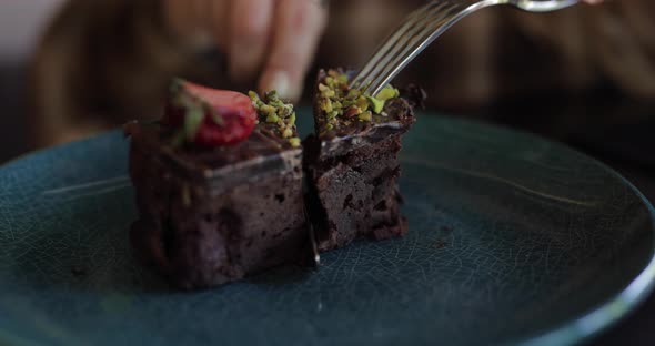 Eating Tasty Chocolate Cake in Restaurant Closeup alt